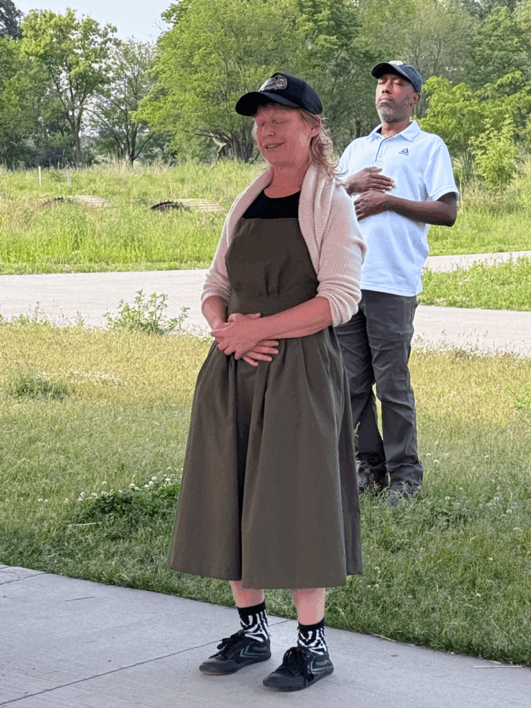 Soundwalk guides lead a grounding exercise with participants at Big Marsh Park.